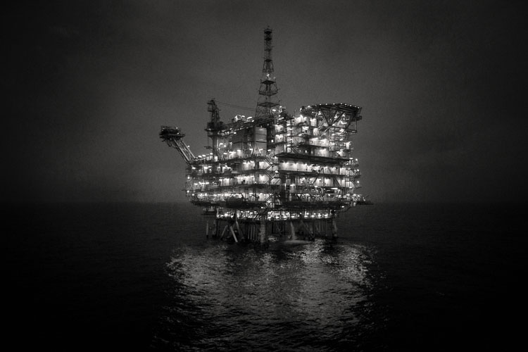Mexilhão gas field is the largest undeveloped gas accumulation in the Brazilian Continental Shelf. The gas field lies in the Santos Basin in Brazil off the coast of Sao Paulo, approximately 160km offshore and in water depths of between 320m and 550m. Mexilhao has reserves estimated at 72 billion cubic meters of gas. The offshore gas field is wholly owned and operated by Petrobras. The Mexilhão 1 platform is installed in a water depth of 172m is the largest offshore metallic structure ever erected in Brazilian waters. The platform stands 230m tall. This stock photo of the oil rig was taken from the Skandi Achiever, a DOF owned diving support vessel.